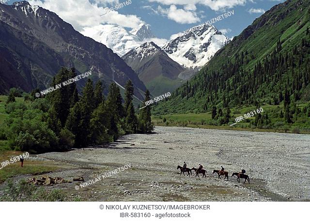 Group of horsemen. Central Tien Shan, Kazakhstan