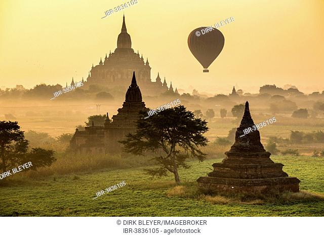 Hot air balloon over the landscape in the early morning fog, Sulamani Temple, stupas, pagodas, temple complex, Plateau of Bagan, Mandalay Division