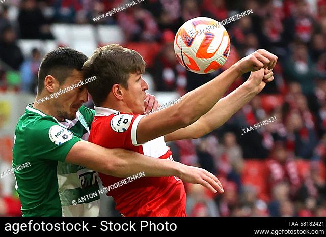 RUSSIA, MOSCOW - APRIL 1, 2023: FC Akhmat Grozny's Milos Satara (L) and FC Spartak Moscow's Alexander Sobolev fight for the ball in their 2022/23 Russian...