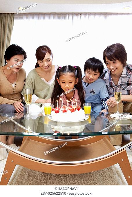 Three-generation family having a birthday party