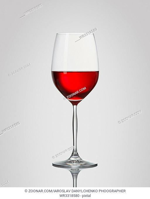 red wine in a glass isolated on a gray background