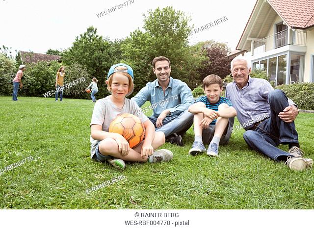 Portrait of happy extended family in garden