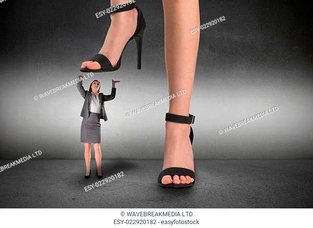 Composite image of female feet in black sandals standing on businesswoman