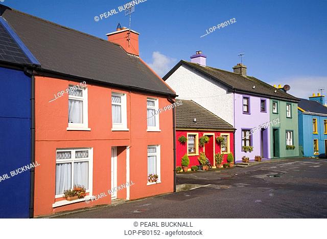 Republic of Ireland, County Cork, Eyeries, Row of colourful traditional houses in main street of village on Ring of Beara tourist route round Beara peninsula