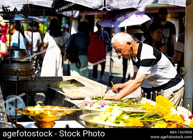 Thailand, Bangkok, scenes at Wat Phra Keo temple, senior, offering fees