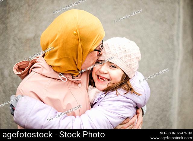 Mother with daughter hugging