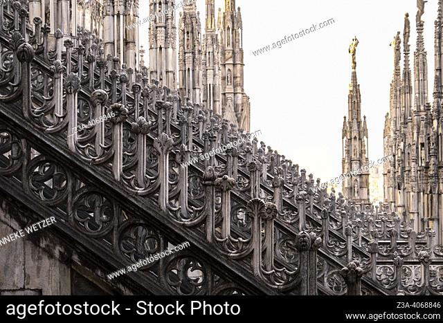 Detail of flying buttresses and pinnacles. Exterior of the 14th century Milan Cathedral (Duomo di Milano) in Milan, Italy, Europe