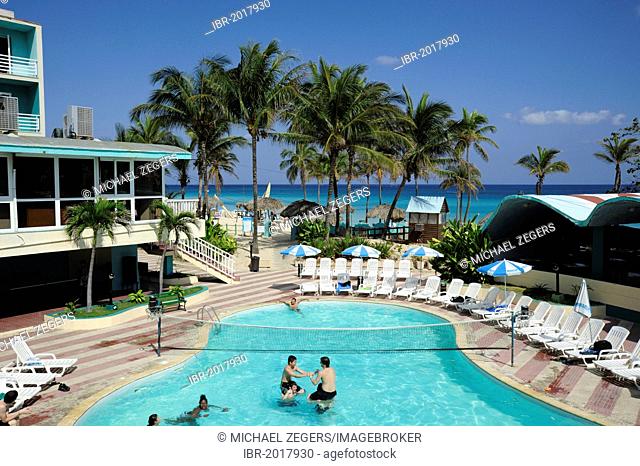 Hotel Atlantico, swimming pool and beach with palm trees, Santa Maria del Mar, Playas del Este, Havana, Habana, Cuba, Greater Antilles, Gulf of Mexico