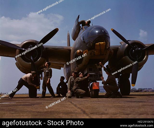 Servicing an A-20 bomber, Langley Field, Va., 1942. Creator: Alfred T Palmer