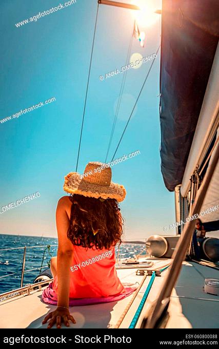 Traveler Girl with Pleasure Taking Sun Bath on the Sailboat. Luxury Summer Trip to Greece. Enjoying Holidays on the Yacht