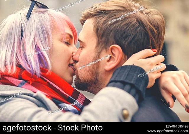 Close up Portrait of a happy young couple in love. They kiss