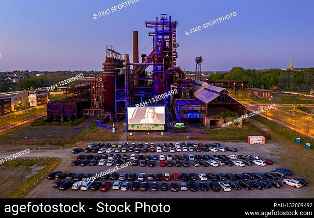 firo: 26.04.2020, Germany, NRW, Dortmund, industrial culture, Ruhr area, cinema in Corona times, drive-in cinema in Dortmund against the backdrop of a typical...