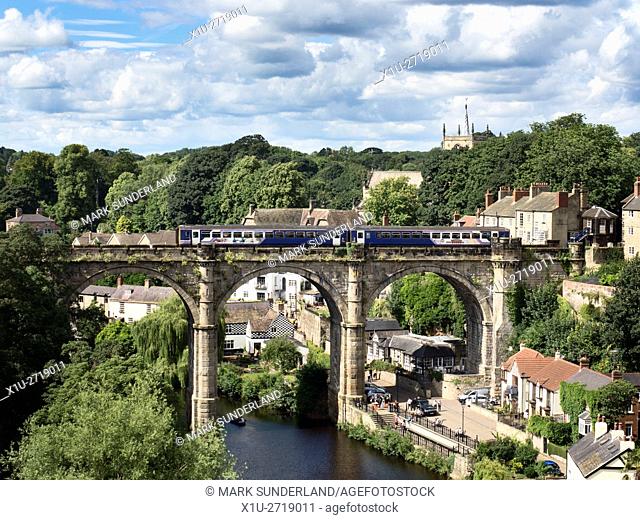 Northern Train Crossing the Railway Viaduct over the Nidd Gorge at Knaresborough in Summer North Yorkshire England