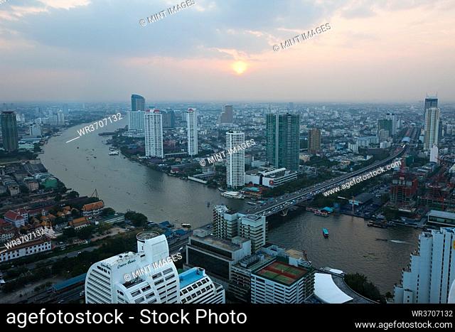 View over Bangkok and the Chao Phraya River, at sunset, Thailand