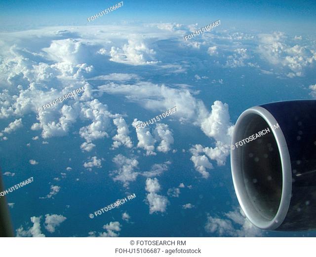Aerial, airplane flying over the Pacific Ocean, clouds