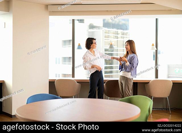 Two women chatting