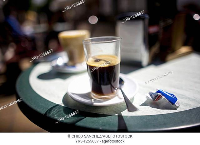 Coffee sits on a table on a coffee shop's terrace in Prado del Rey village, Cadiz province, Andalusia, Spain