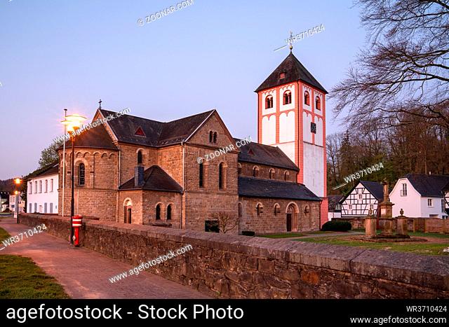 Center of village Odenthal with parish church and old buildings in early morning light, Bergisches Land, Germany