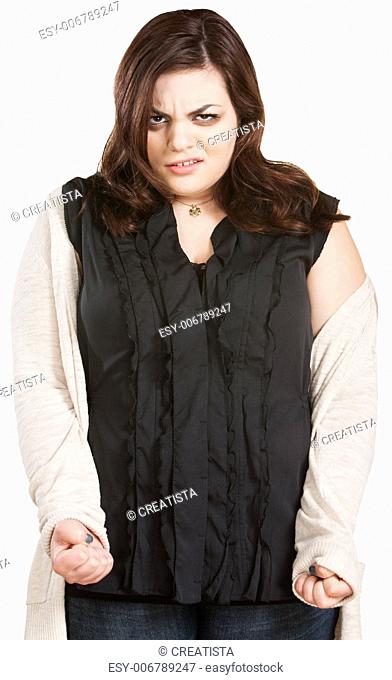 Young Caucasian woman with clenched fists over isolated background