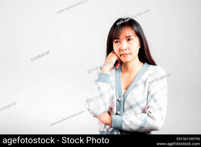 Happy woman hand touch chin handle relaxed thinking about something about the question, Portrait Asian beautiful young female idea think studio shot isolated on...