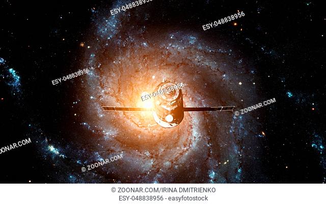 Spacecraft Progress orbiting the galaxy. Elements of this image furnished by NASA
