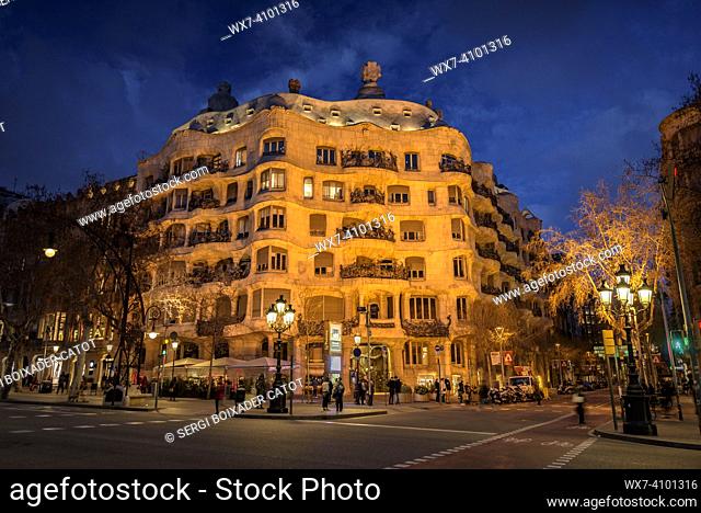 The Casa MilÃ  (La Pedrera) at sunset, twilight and blue hour on the Passeig de Gracia in Barcelona (Catalonia, Spain)