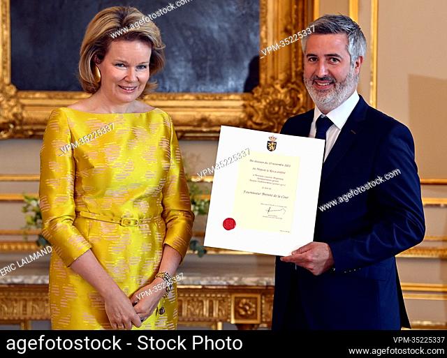 Queen Mathilde of Belgium and Laurent Brogneaux, Anciens Etablissements Goosse pictured during a royal reception with the newly appointed suppliers holding a...