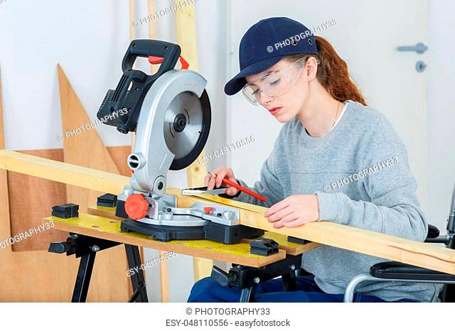 woman carpenter in wheelchair