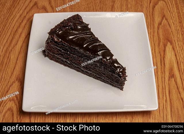 Piece of decadently delicious traditional chocolate fudge cake