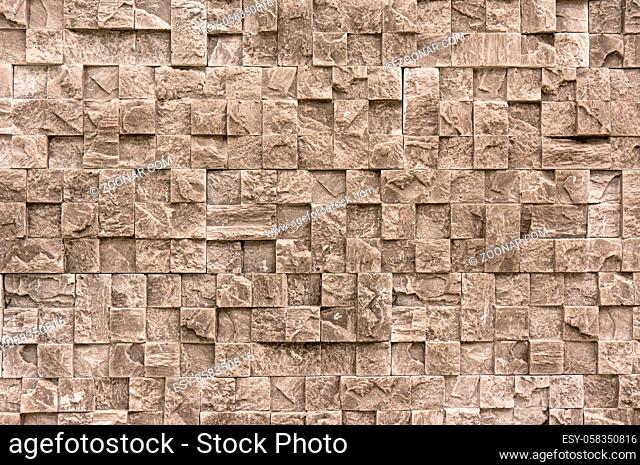 White cream marble stone limestone brick tile wall surface aged texture detailed pattern background. Classic tile wall texture for interior