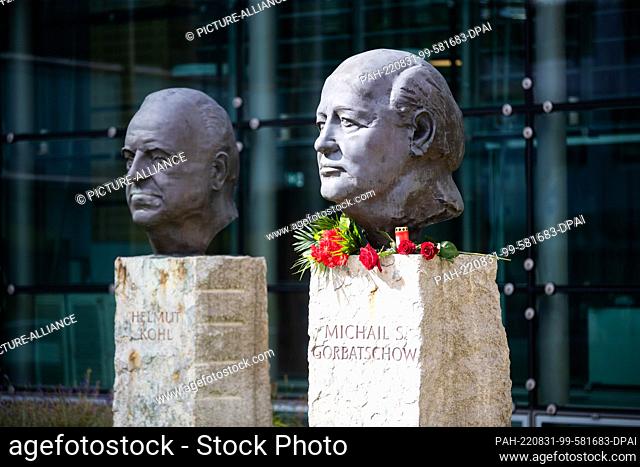 31 August 2022, Russia, Moskau: Flowers lie at the monument ""Fathers of Unity"" by the French sculptor Serge Mangin at the head of the last president of the...