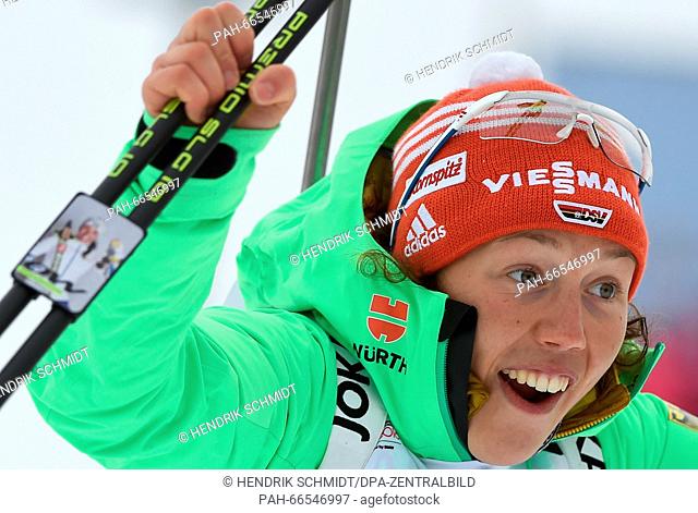 Bronze medalist Laura Dahlmeier of Germany celebrates during the flower ceremony for the Women 15km Individual competition at the Biathlon World Championships