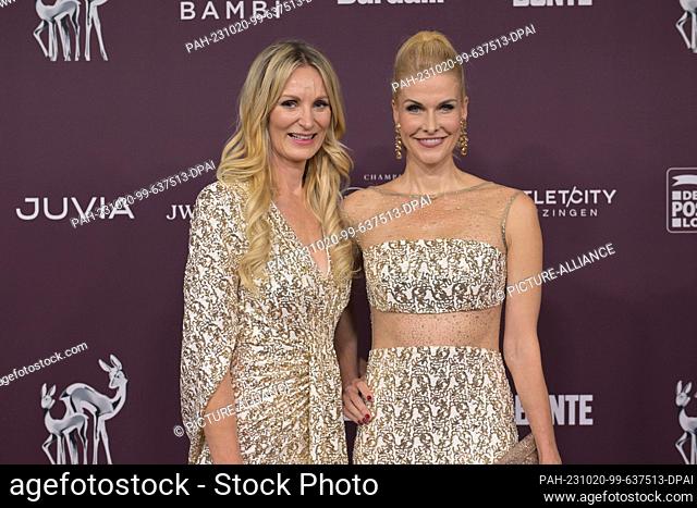 19 October 2023, Berlin: Julia Poh (l) and Natascha Gruen present themselves on the red carpet at the charity event ""Tribute to Bambi""