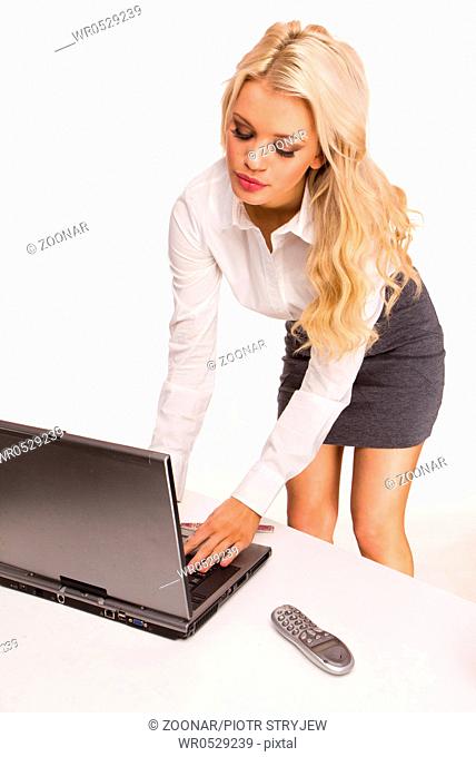 Sexy Business women using her laptop