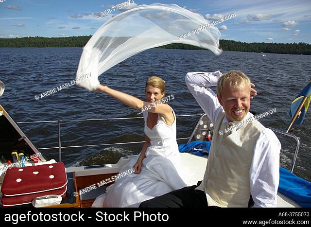 Wedding. The bride and groom go by boat to the party after the wedding in the church