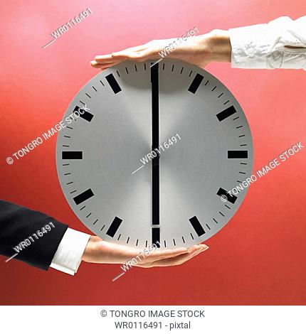 hand holding clock