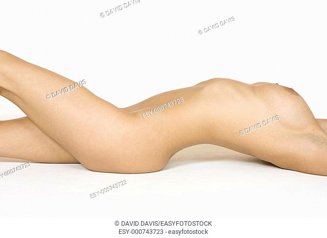 Very sexy and beautiful Caucasian woman posing nude on a white background