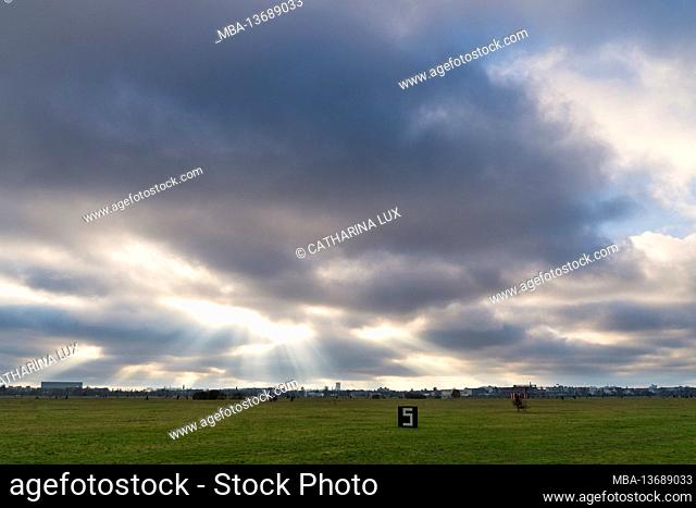 Berlin, Tempelhofer Feld, former Tempelhof Airport, huge open space, clouds with light fingers