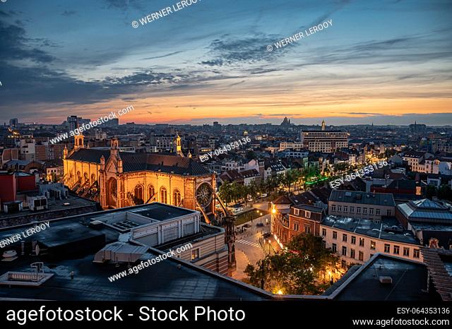 Brussels city center, Belgium, July 20 , 2023 - Colorful sunset over old town with the Saint Catherine church and rooftops