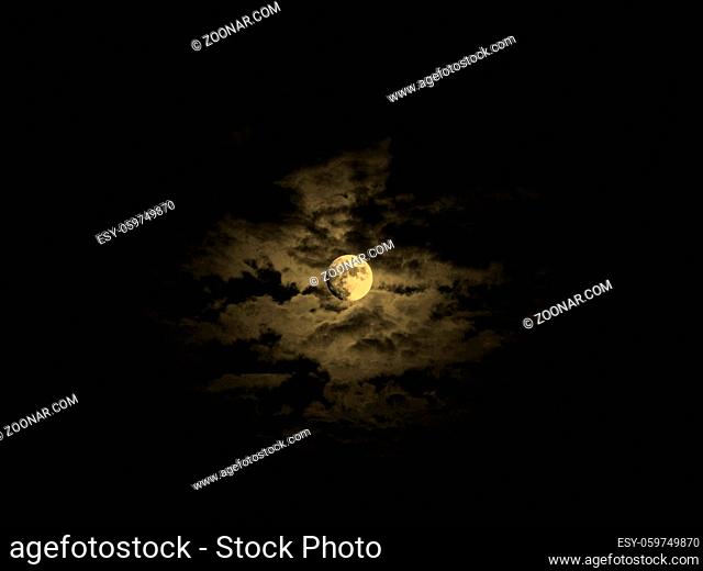 Dark baroque sky with full moon and clouds vintage sepia