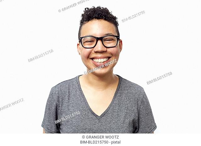 Smiling mixed race woman wearing eyeglasses