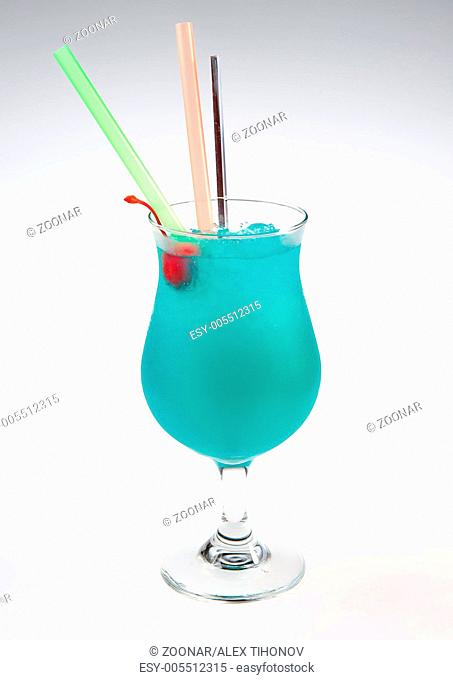 Blue alcoholic cocktail over white background