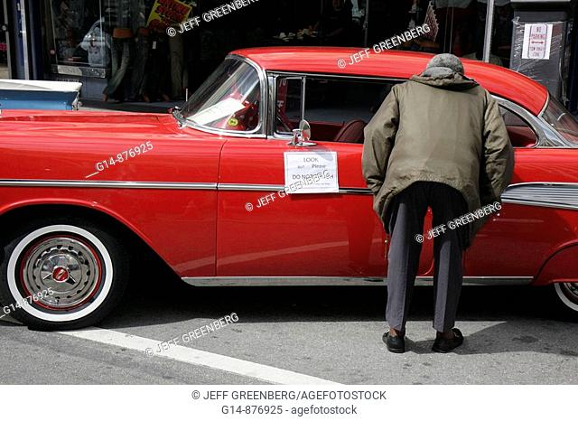 Florida, Miami, downtown, Flagler Street, Bike Miami Days, community event, Classic Car, 1957 Chevrolet, auto, man, looking, red paint, sign, look do not touch