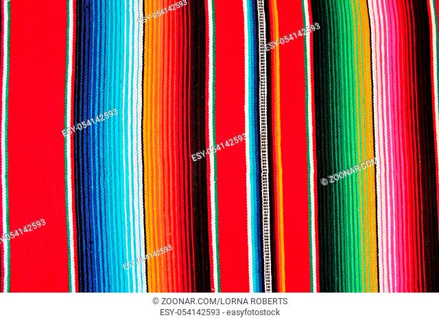 poncho Mexico traditional cinco de mayo rug poncho fiesta background with stripes copy space