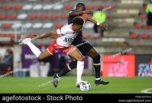 Mouscron's Nuno Da Costa and Antwerp's Abdoulaye Seck fight for the ball during a soccer match between Royal Excel Mouscron and Royal Antwerp FC
