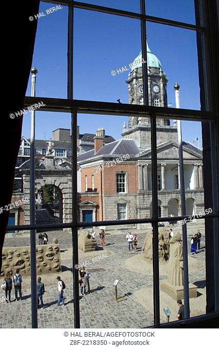 Bedford Tower built 1761 and the courtyard with an art show viewed from a window in Dublin Castle, seat of English rule in Ireland