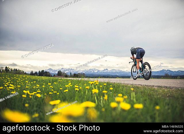Professional triathlete on her road bike, time trial bike round, Auerberg, Allgäu, Bavaria, Germany