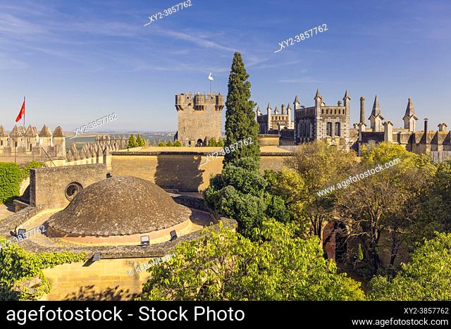 Almodovar del Rio, Cordoba Province, Andalusia, Spain. Almodovar castle. Overall view. The domed building is the chapel. The tower with the flag is the Torre de...