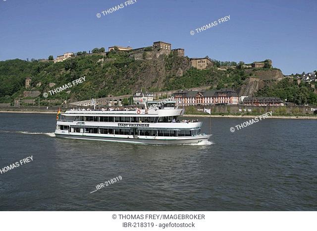 An excursion boat in front of the fortress Ehrenbreitstein in Koblenz Rhineland-Palatinate Germany