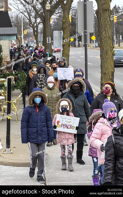 Royal Oak, Michigan USA - 17 January 2022 - Hundreds of parents and children joined a march to commemorate Martin Luther King Jr. Day